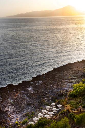 a view of the ocean at sunset at Hotel Club San Diego in Maratea