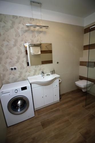 Ванная комната в Apartamenty Przy Latarni Kropla Bałtyku