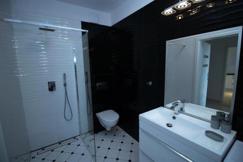 Ванная комната в Apartamenty Przy Latarni Kropla Bałtyku