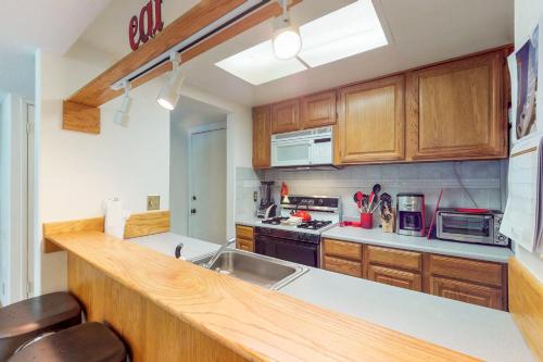 a kitchen with a sink and a counter top at Sierra Sky in Tahoe City