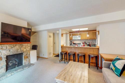 a living room with a couch and a fireplace at Sierra Sky in Tahoe City