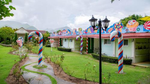 a group of candy canes in front of a house at Baan Kung Kang De Pai in Pai