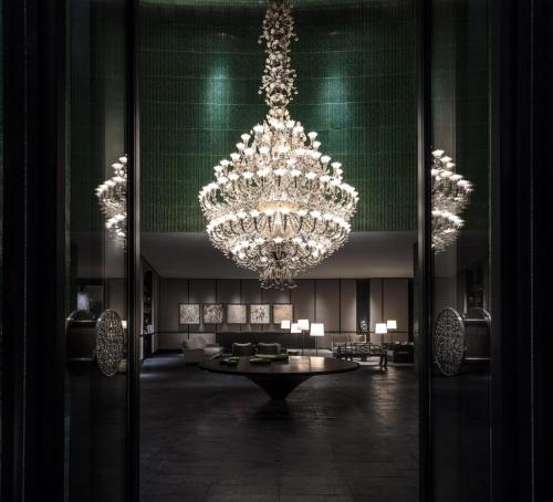 a large lobby with a large chandelier in a building at The Middle House in Shanghai