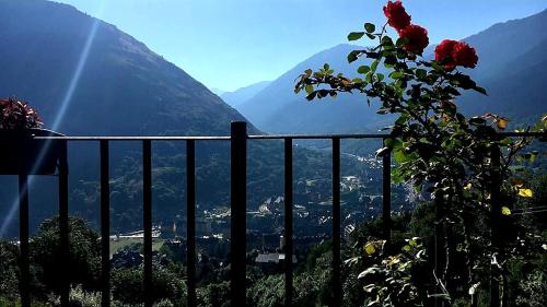 a fence with a view of a mountain at Casa Rural Cuny in Casau