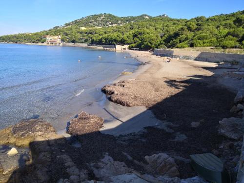 a view of a beach with rocks in the water at Stella Maris in Hyères