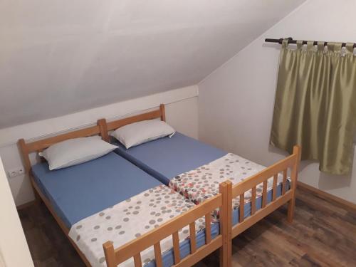 Ένα ή περισσότερα κρεβάτια σε δωμάτιο στο Andjela Apartments