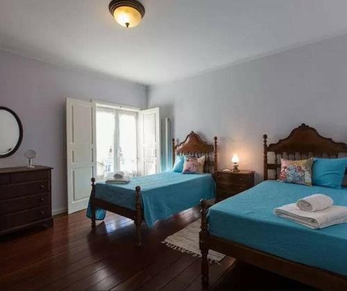 Tempat tidur dalam kamar di Stunning view Alcobaça