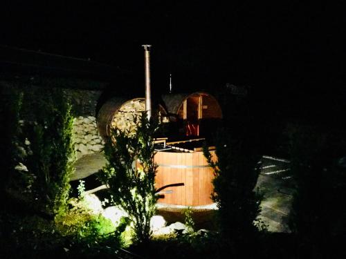 a wooden boat in a yard at night at Apartmán 16 Romantika Chopok Juh Tále in Tale