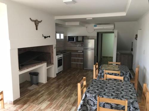 Η κουζίνα ή μικρή κουζίνα στο Loma Soleada Apart Hotel