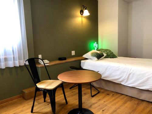 Postel nebo postele na pokoji v ubytování Hotel 3 O'Clock Tennoji