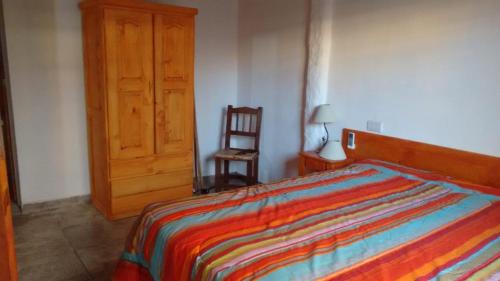 
A bed or beds in a room at El Encuentro
