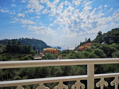 a view of a city from a balcony at Arianna in Paleokastritsa