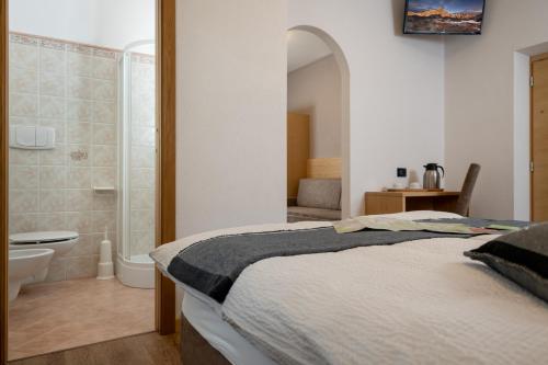 Säng eller sängar i ett rum på GARNI' Margherita