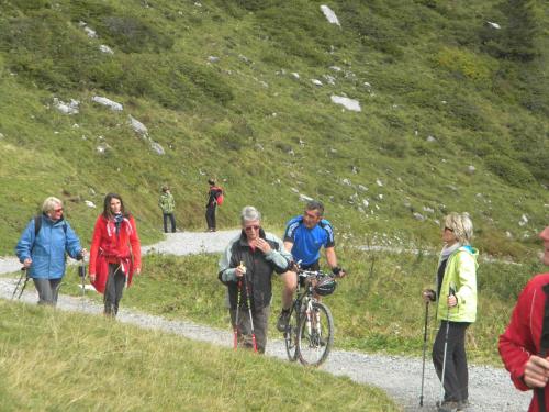 a group of people walking up a mountain trail at Haus Kinsperger in Klösterle am Arlberg