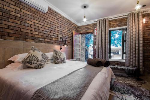 Ένα ή περισσότερα κρεβάτια σε δωμάτιο στο St Lucia Livingston Lodge