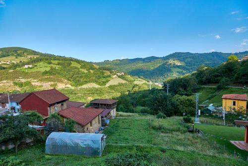 an aerial view of a village with mountains in the background at Casa Pichi in El Pulliu