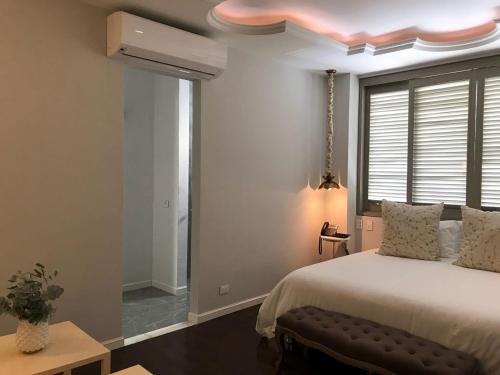 Postel nebo postele na pokoji v ubytování Hotel Monaguillo de Getsemaní