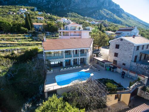 an aerial view of a house with a swimming pool at Villa Narcissus Montenegro KO Sveti Stefan in Sveti Stefan