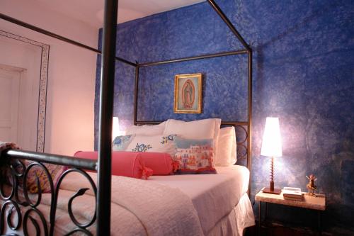 Ένα ή περισσότερα κρεβάτια σε δωμάτιο στο Suites Santo Domingo