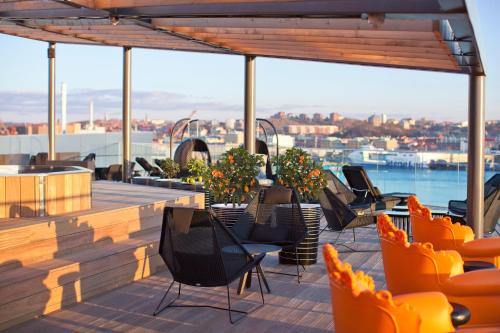 a deck with chairs and a view of the water at Radisson Blu Riverside Hotel in Gothenburg