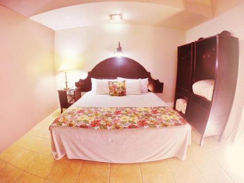 a bedroom with a large bed in a room at Tenondé Park Hotel in São Miguel das Missões