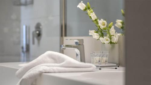 Salle de bains dans l'établissement Hotel Maxim