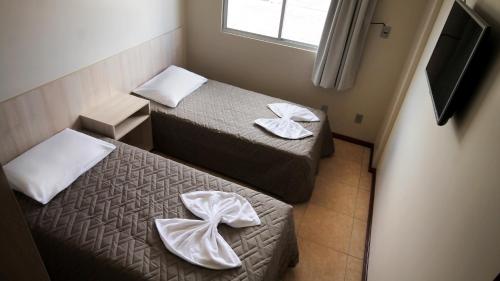 TV a/nebo společenská místnost v ubytování Hotel Ricardi Express