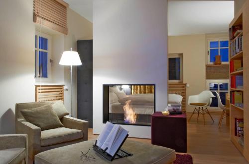 a living room with a fireplace and a couch at Lösch für Freunde in Hornbach