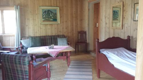 Postel nebo postele na pokoji v ubytování Fossheim Hotel Lom