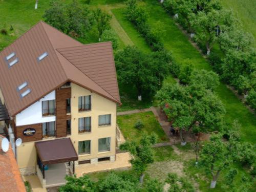 an overhead view of a house with a brown roof at Stupina in Braşov