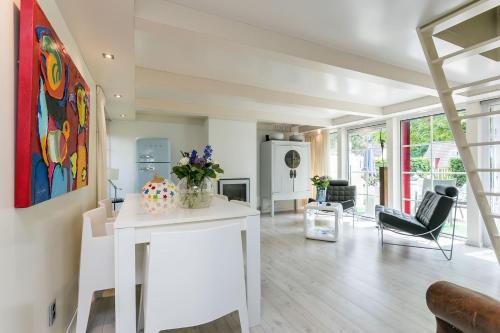 a living room with a white island with flowers on it at Julia's Holiday Home in Simpelveld