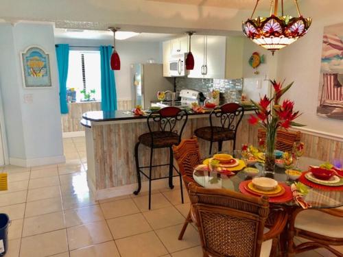 a kitchen with a table and chairs and a dining room at 2 Bedroom , 2 Bath , Villa in Oldsmar