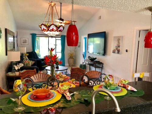 a living room with a table with plates of food at 2 Bedroom , 2 Bath , Villa in Oldsmar