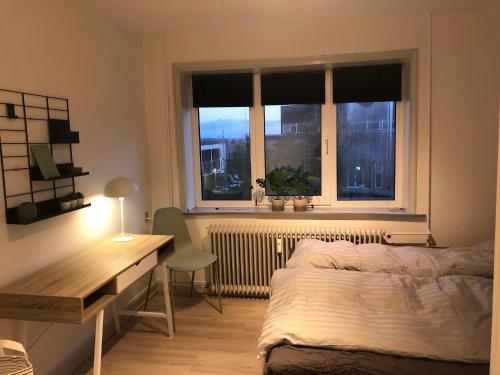 Postel nebo postele na pokoji v ubytování Hel lejlighed Thisted Midtby
