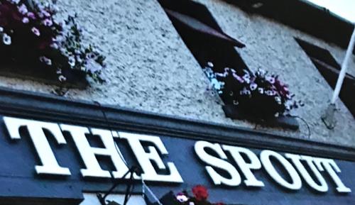 a sign on the side of a building that says the spot at The Rooms at The Spout in Kilcullen