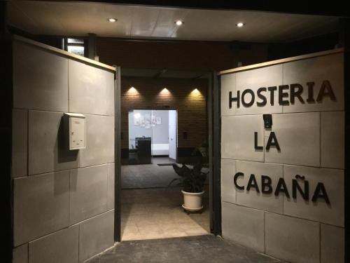 an entrance to a building with the words hospital la laaza at H La Cabaña in Pozuelo de Alarcón