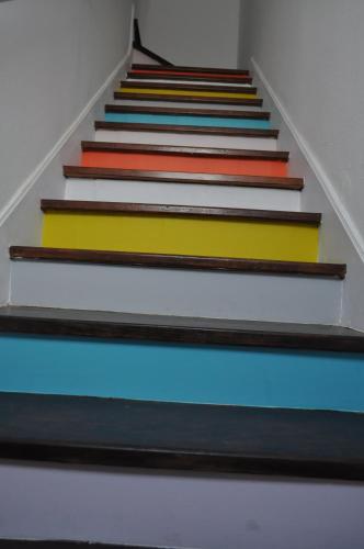 a set of stairs with colorful paint on them at A Casa do Mestre in Évora