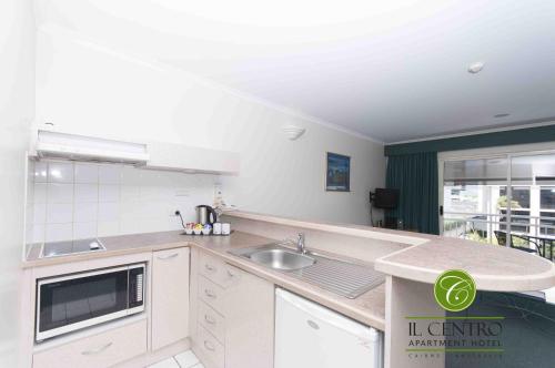 A kitchen or kitchenette at Il Centro Apartment Hotel