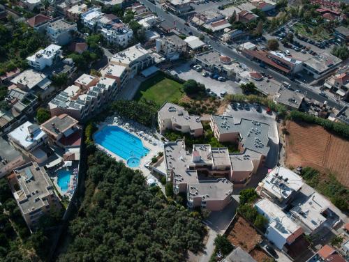 an aerial view of a building with a pool at Atrion Resort Hotel in Agia Marina Nea Kydonias