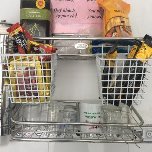 a shelf in a refrigerator filled with food at NGỌC QUÝ Mini House in Quy Nhon