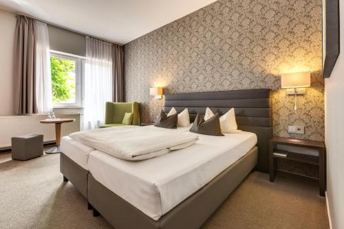 Postel nebo postele na pokoji v ubytování Hotel Hiemann - Superior