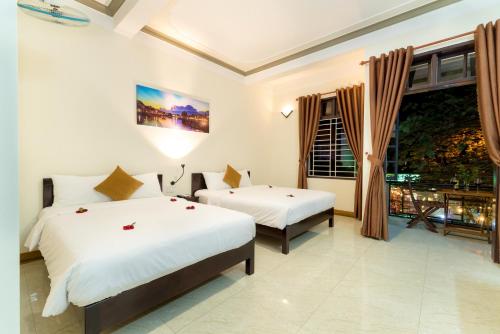 Giường trong phòng chung tại Hoa Thu Homestay