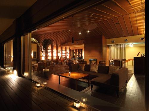 a living room with a couch and a table at Kotohira Kadan in Kotohira