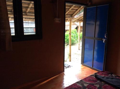 an open door to a room with an open door at My beautiful cottage in pokhara in Pokhara