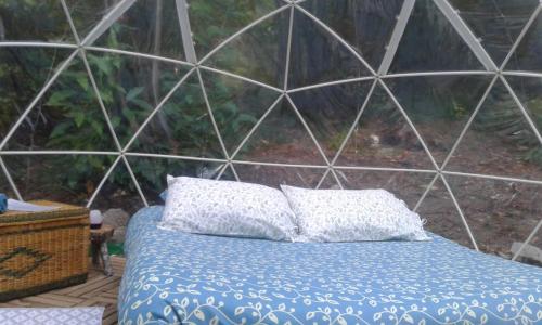 Postel nebo postele na pokoji v ubytování bulle sous les etoiles