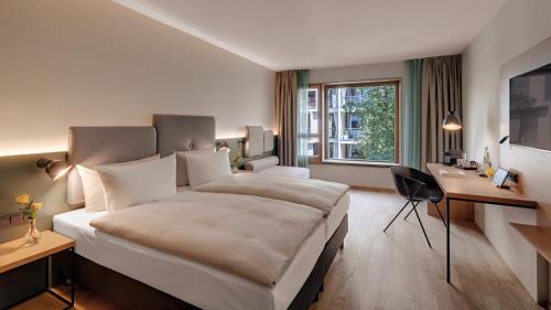 Postel nebo postele na pokoji v ubytování Hotel the YARD Berlin