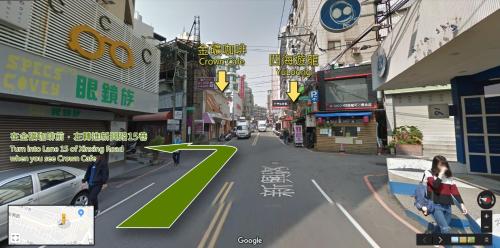 a rendering of a city street with a green arrow at T-Life Hostel in Longjing