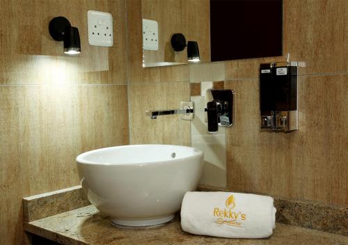 a bathroom with a large bowl sink on a counter at Rekky Signature Guesthouse in Johannesburg