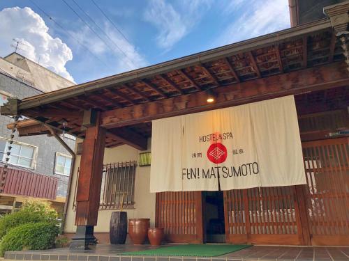 a sign on the front of a building at Asama Onsen FAN! MATSUMOTO in Matsumoto