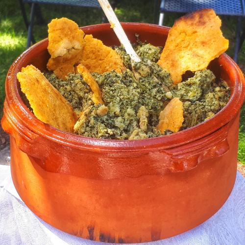 a bowl of food sitting on top of a table at Agriturismo Terra e Sapori in Campodipietra